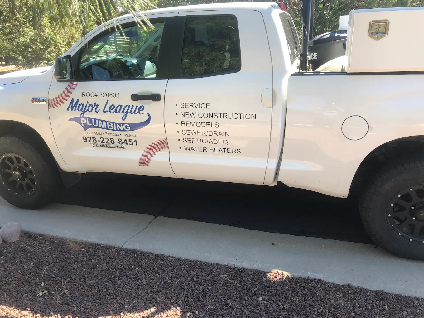 Major League Plumbing service truck in Show Low, AZ with baseball-stitch graphics